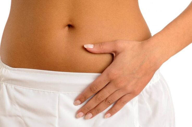 Pain in lower abdomen as a symptom of cystitis in women